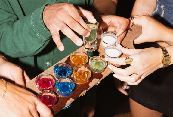 people taking shots at revolution bars
