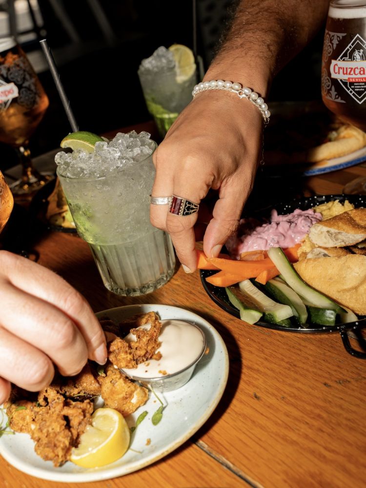 plates of food with drinks for a bottomless drinks with food experience at revolution bars