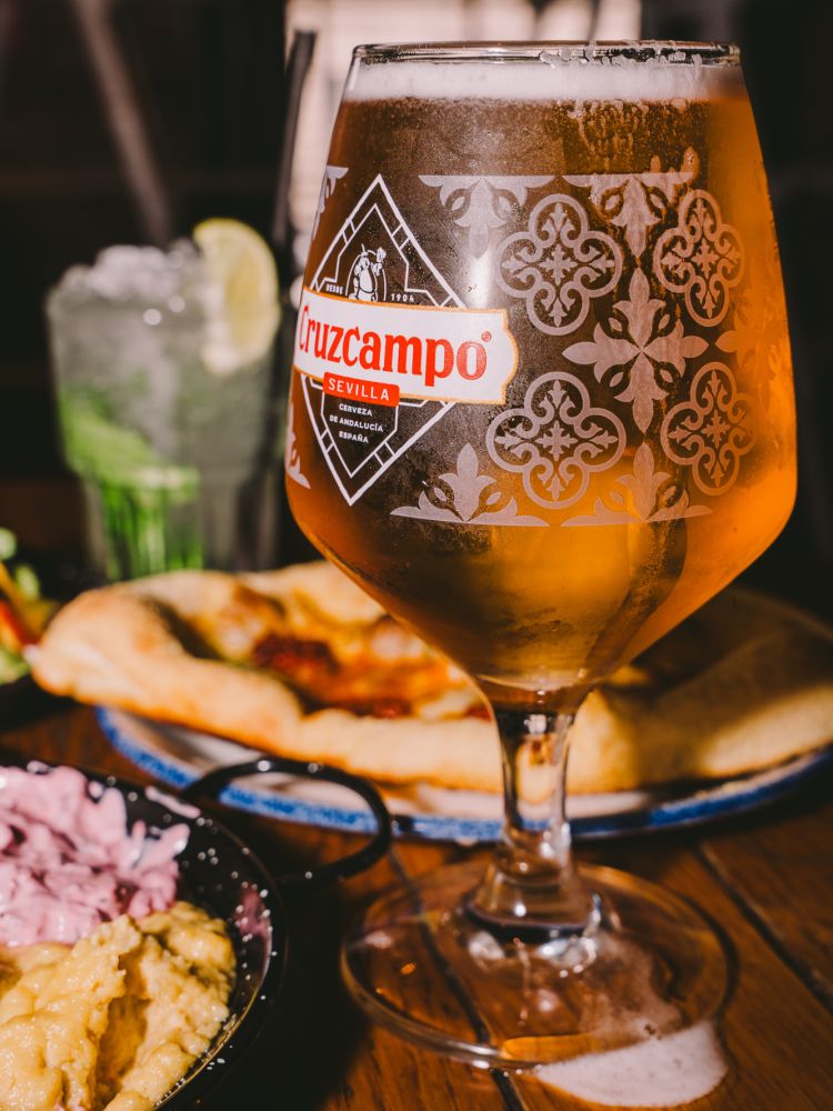 close up of beer for a bottomless drinks with food experience at revolution bars