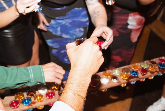 people enjoying shots at revolution bars