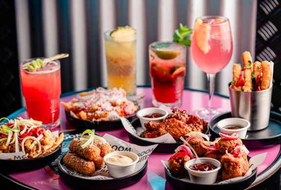 brunch with drinks on table at a boom battle bar