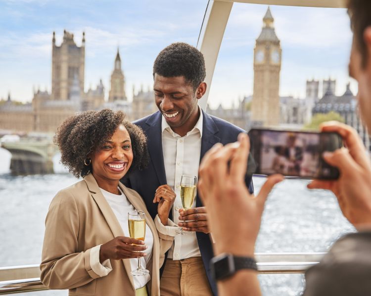Couple with glasses of champagne on the london eye
