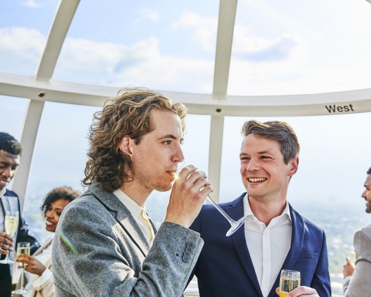 People drinking champagne on the london eye