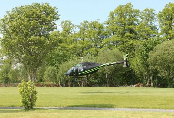 a black helicopter taking off for a nottingham helicopter ride