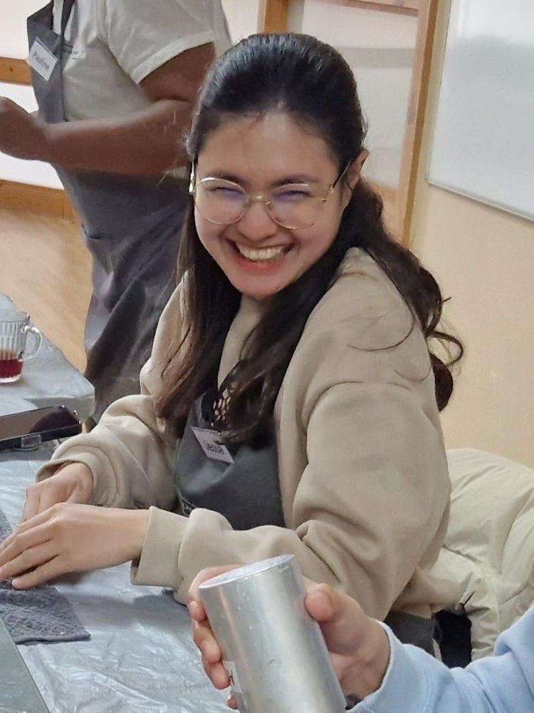 Girl smiling at candle making workshop