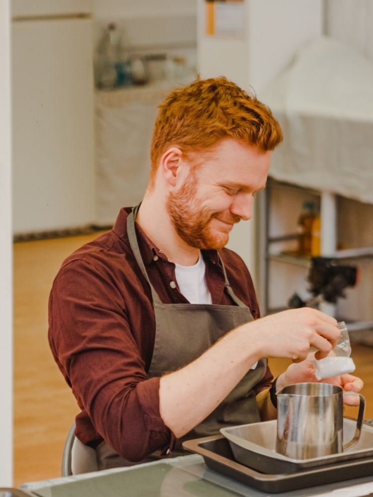 Two men at a candle making workshop