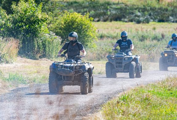 people riding quad bikes on dirt track in devon
