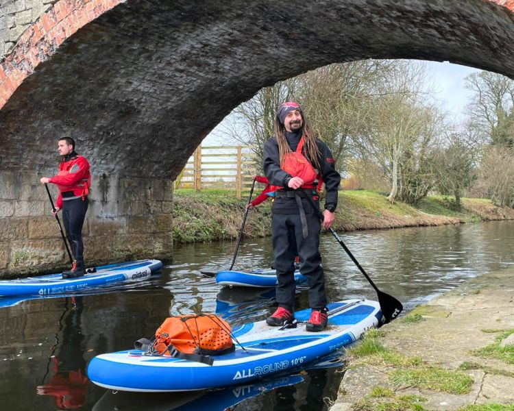 Instructor smiling while sup boarding
