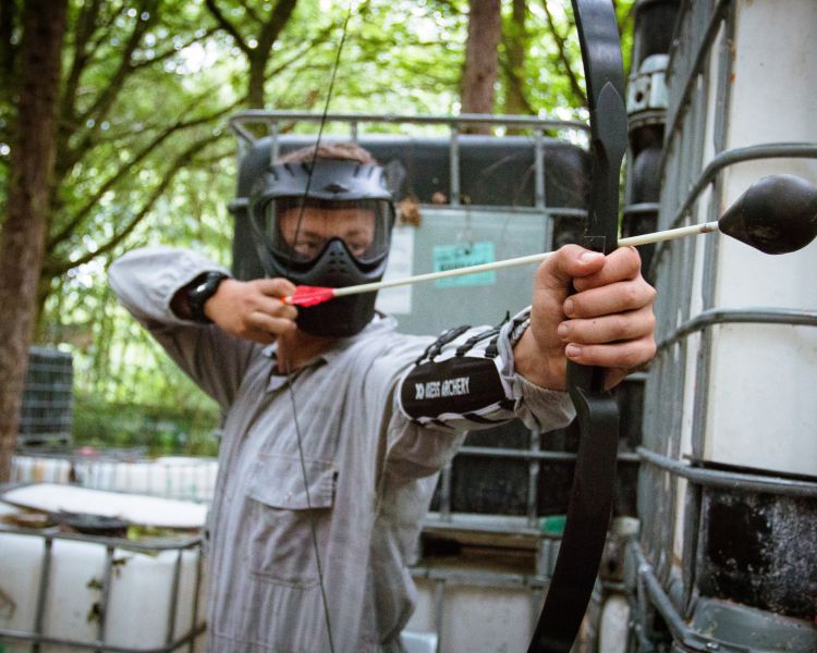 Man pulling arrow on combat archery experience
