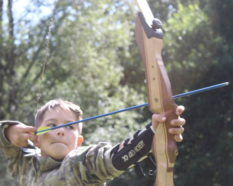 boy on archery experience