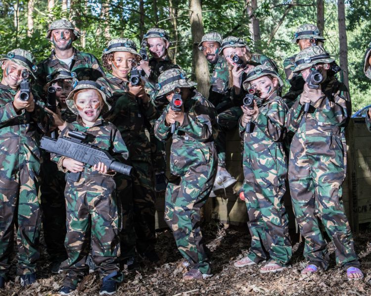 group of kids on outdoor laser combat experience in woodland