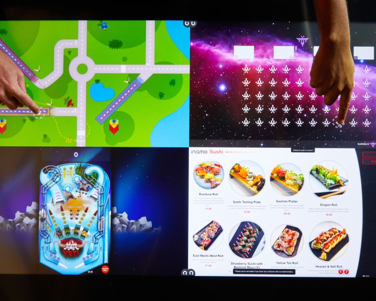 interactive table at inamo london showing games and menu
