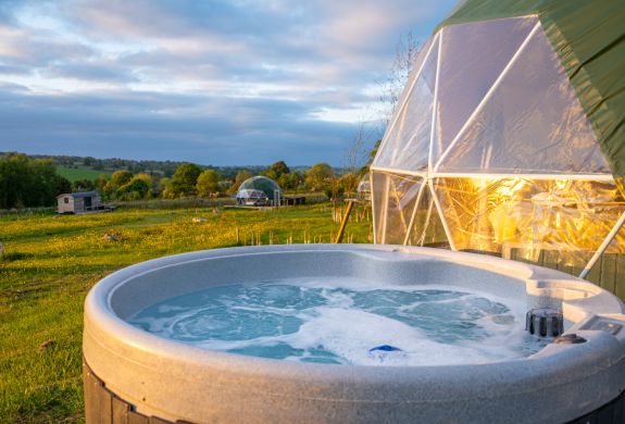 Geodome hot tub at sunset