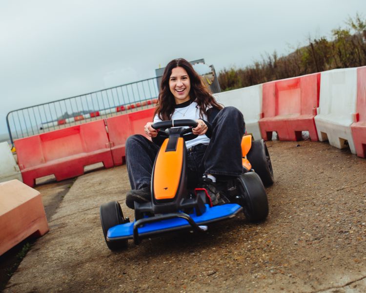 girl on go kart on a family driving day