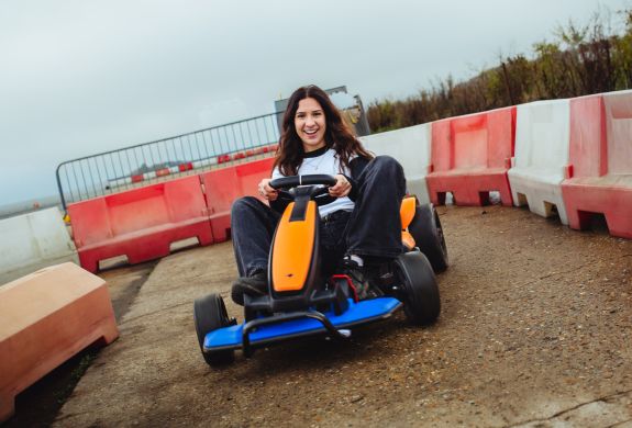 girl on go kart on a family driving day
