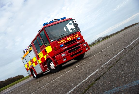 a dennis sabre fire engine on a track for a fire engine driving experience