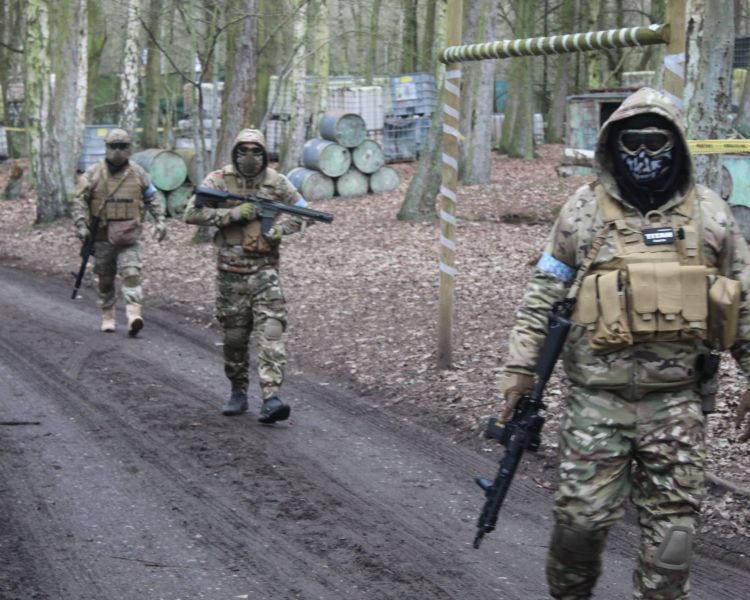 three men in combat gear on airsoft course near wolverhampton
