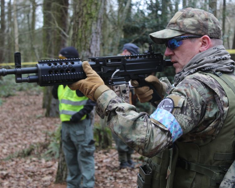 man aiming airsoft gun on airsoft combat experience near wolverhampton
