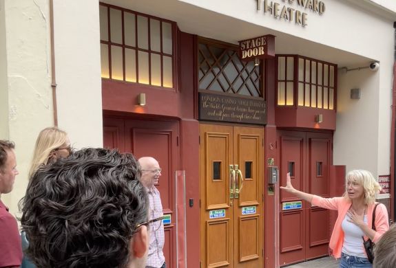 tour group outside the prince edward theatre in london