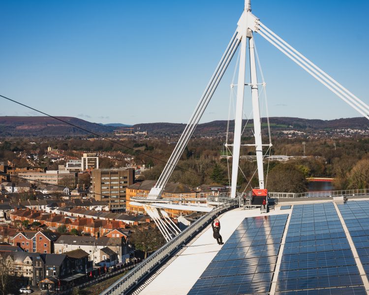 Zip lining across roof of principality stadium in cardiff