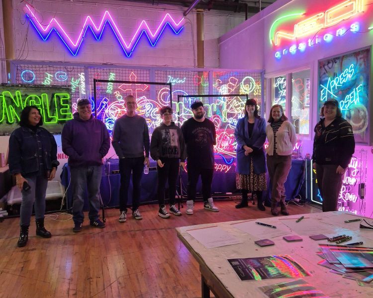 group on neon sign taster session