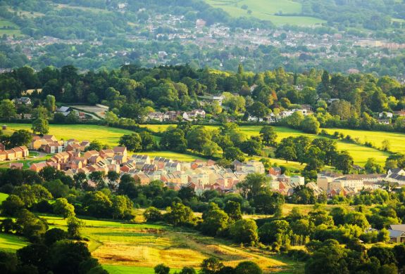 villages in the cotswolds seen from above on a helicopter ride