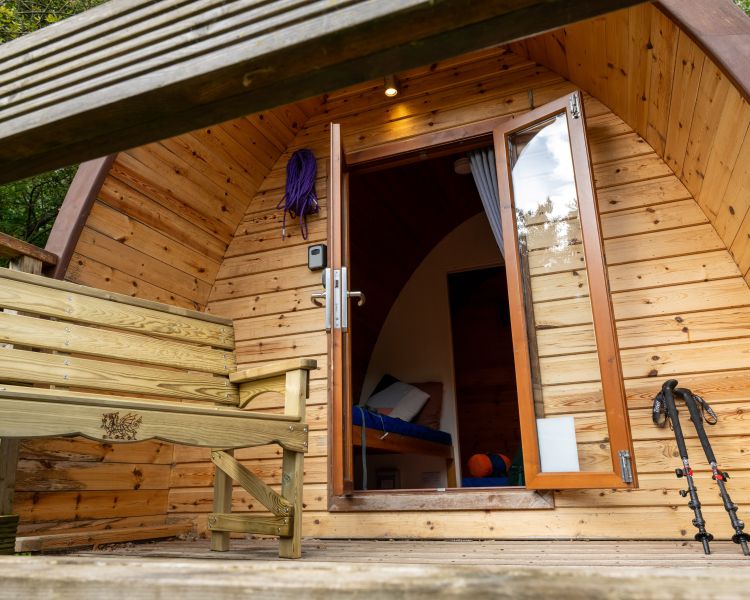 entrance to wooden pod at activity centre in wales for overnight stay