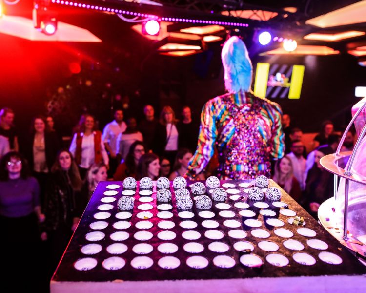 Bingo balls on stage showing crowds