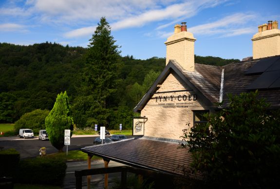 View of zip world inn surrounded by woodland