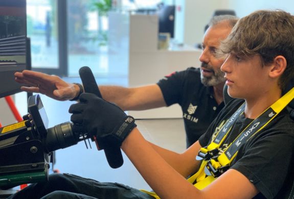 A boy and instructor driver training