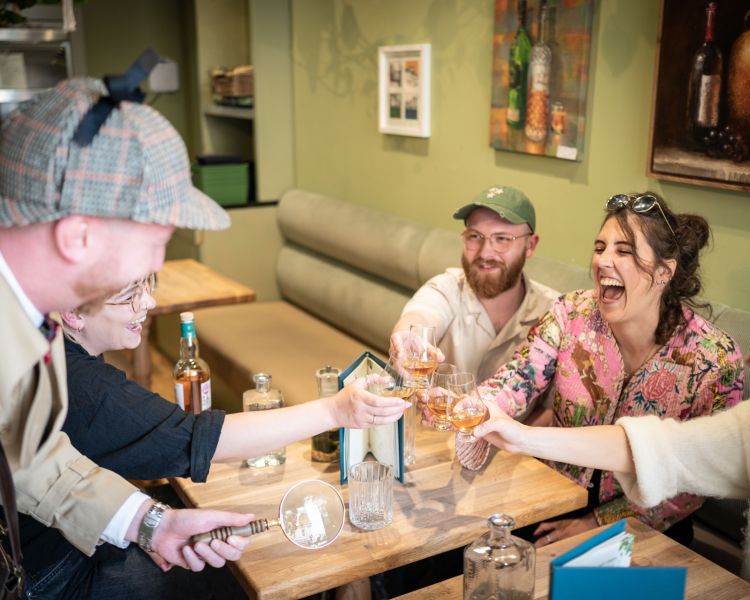 group enjoying a whisky tasting on a historical walking tour in edinburgh