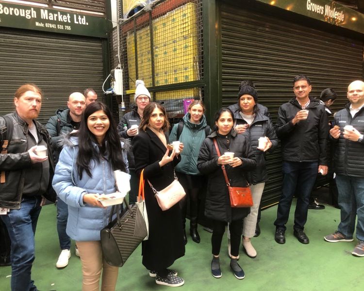 Tour group in borough market on a london food tour