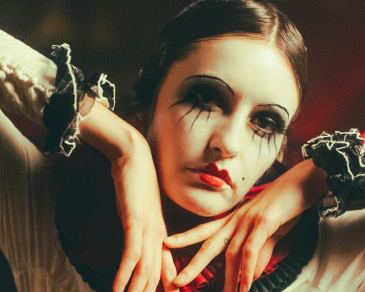 actress in pierrot costume at chat noir immersive show and dining experience in london