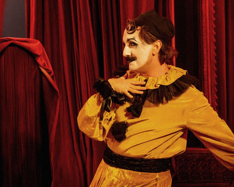 actor in pierrot costume at chat noir immersive show and dining experience in london