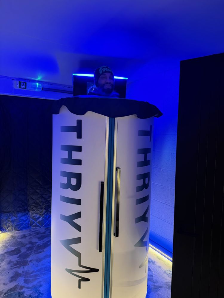Man inside cryotherapy chamber for treatment at thriyv clinic