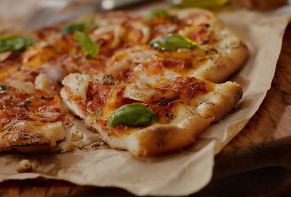 Margarita pizza on brown paper