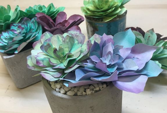 flowers made out of coloured paper on a craft workshop