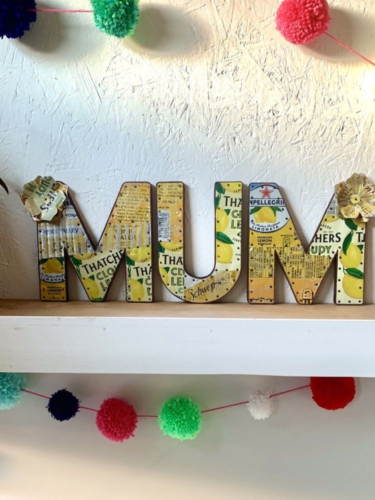 metal letters spelling mum made from recycled drinks cans