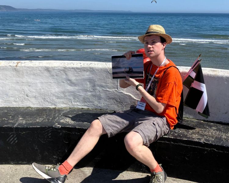 guide talking to group on the seafront on the beyond paradise locations tour