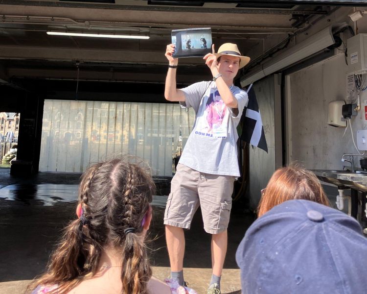 guide talking to group on beyond paradise locations tour