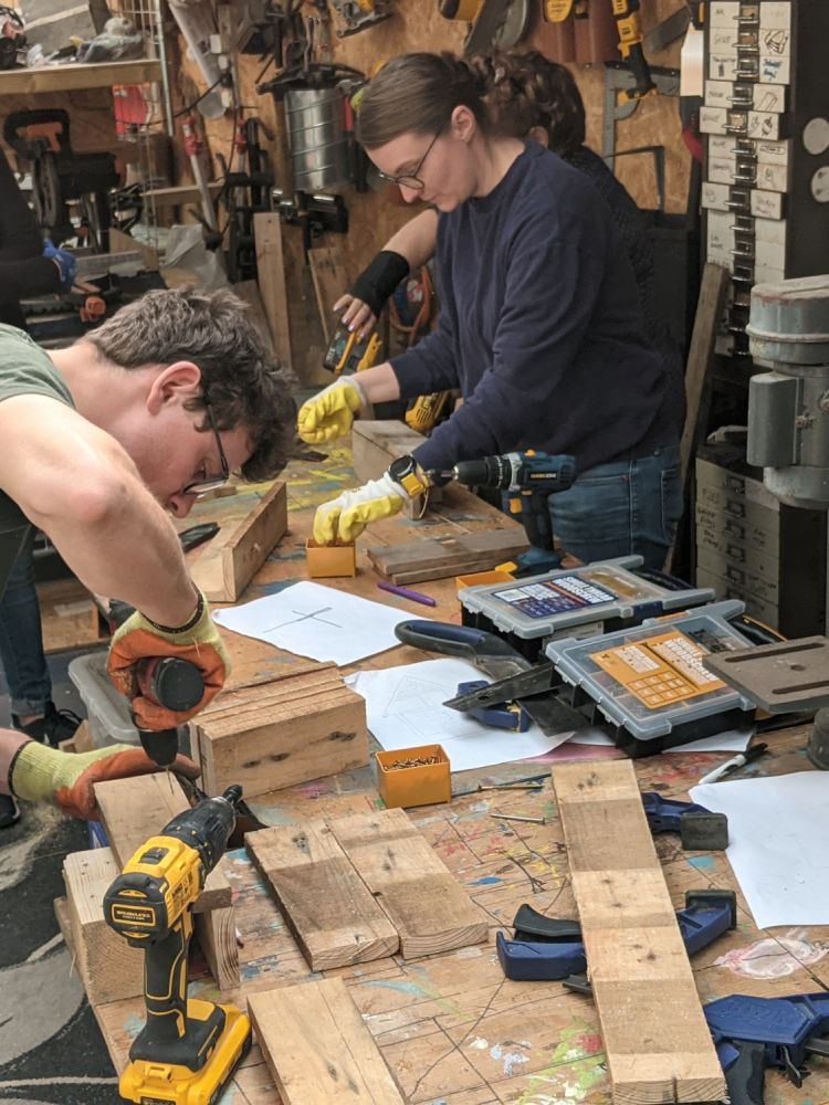 people working in workshop on campervan conversion course
