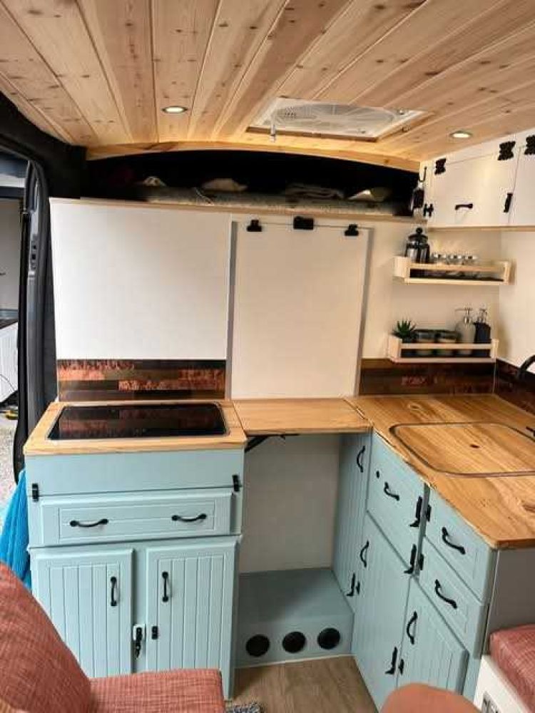 interior of a campervan showing the small kitchen area