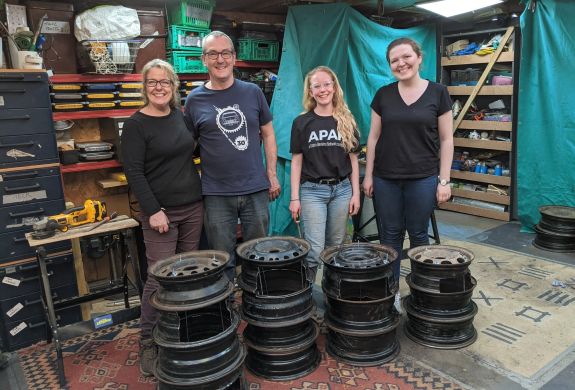 group with their hand made fire pits made on a one day course
