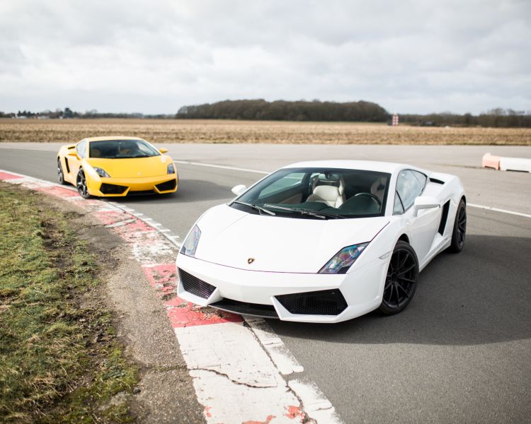 White and yellow lambirghini gallardo supercars on track
