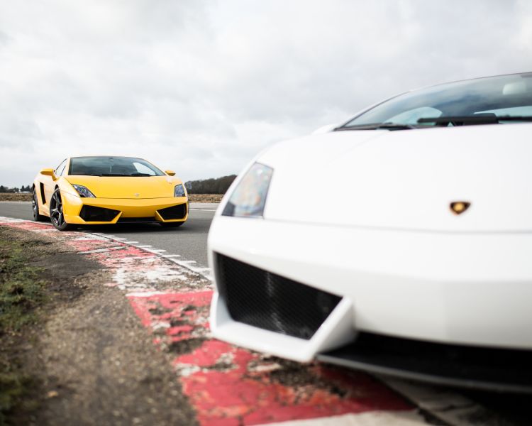 White and yellow lamborghini gallardo on track