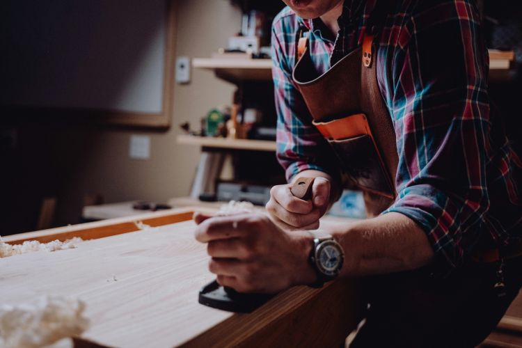Stock image of man in woodworking workshop