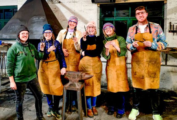 Group holding coat hooks made on blacksmith experience