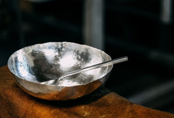 a copper bowl and spoon plated in silver made on a silversmith day course