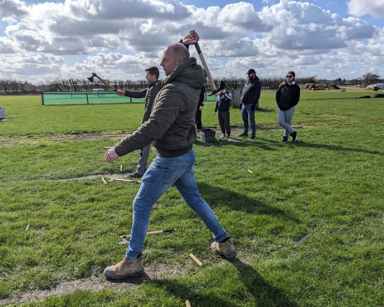 man ready to throw axe on an axe throwing experience
