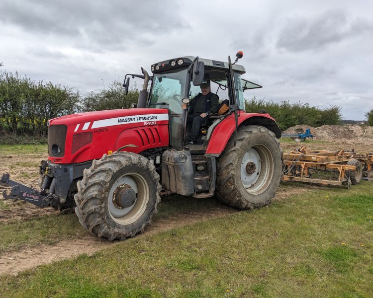 man sitting in tractor on a tractor driving experience